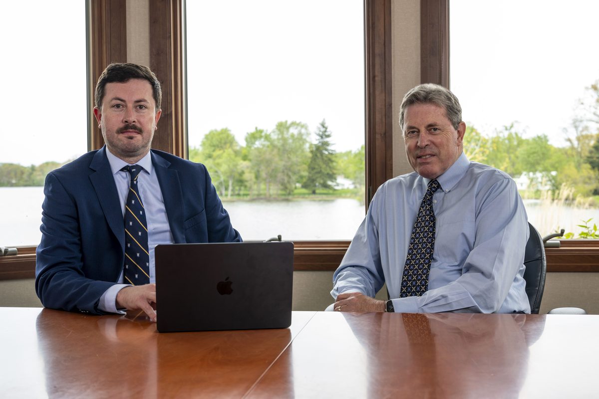 Charles and Robert Gross reviewing a case